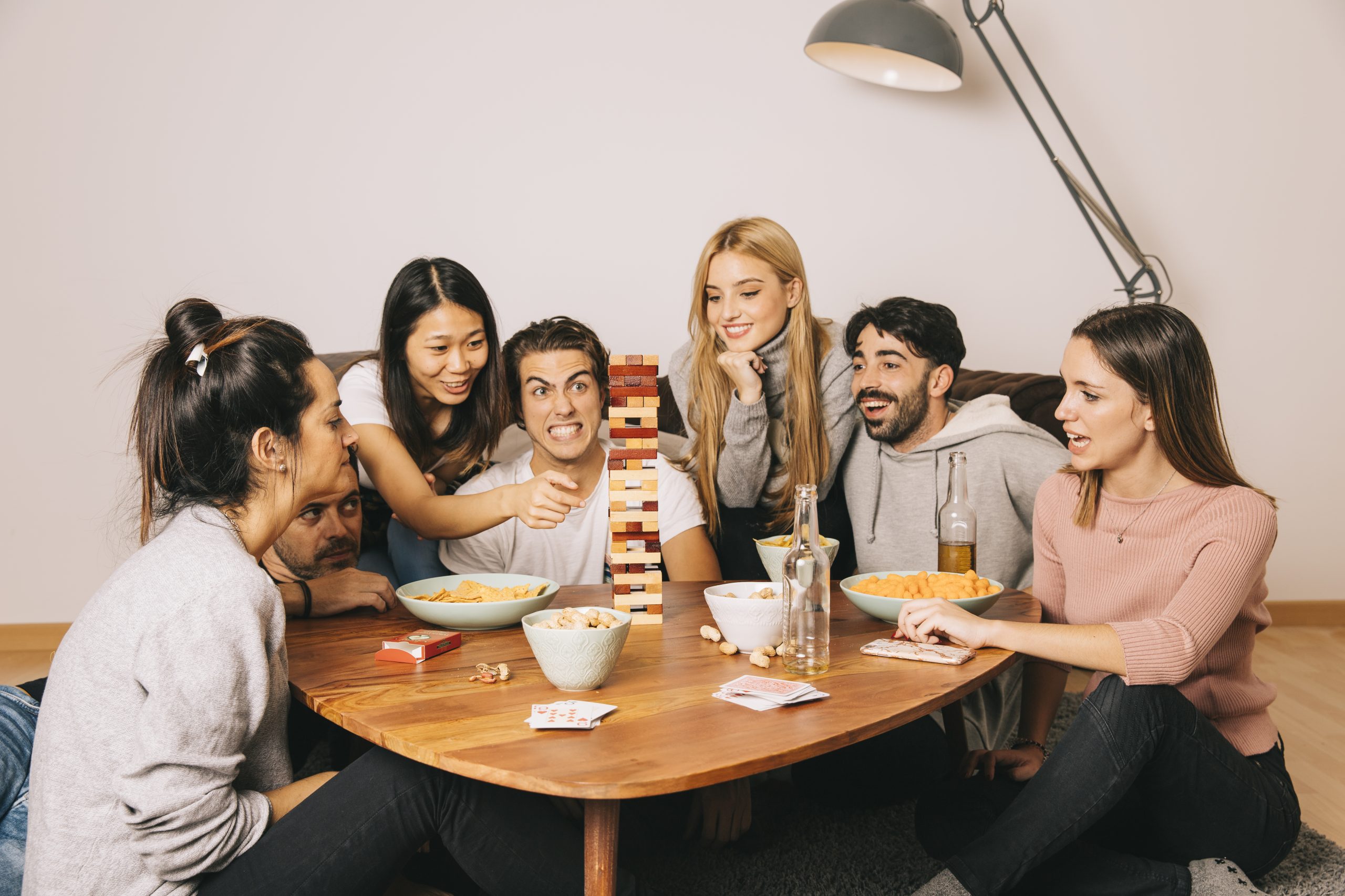 happy friends playing tabletop game 1 scaled MICE
